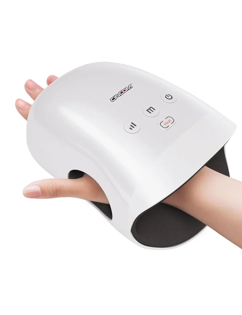 A hand placed inside a white CINCOM CM-026H electric hand massager, showing the top control buttons for power, mode, heat, and intensity.