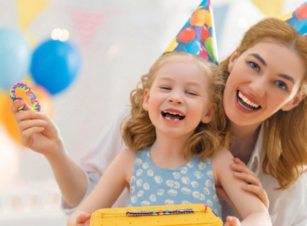 Hands of a child using a DIY bracelet maker tool to weave a complex pattern with colorful cotton strings, demonstrating how to make handmade jewelry.